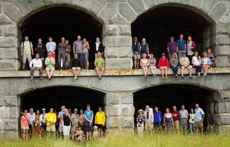 Members of the Friends of Fort Gorges and volunteers gather for a group photo.