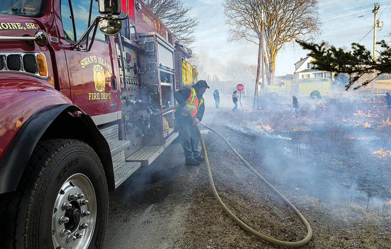 Volunteers work at burning fields on Swan's Island.