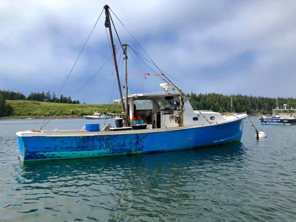 A boat docked in Isle au Haut.