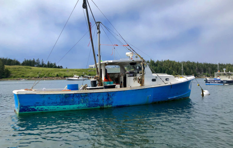 A boat docked in Isle au Haut.