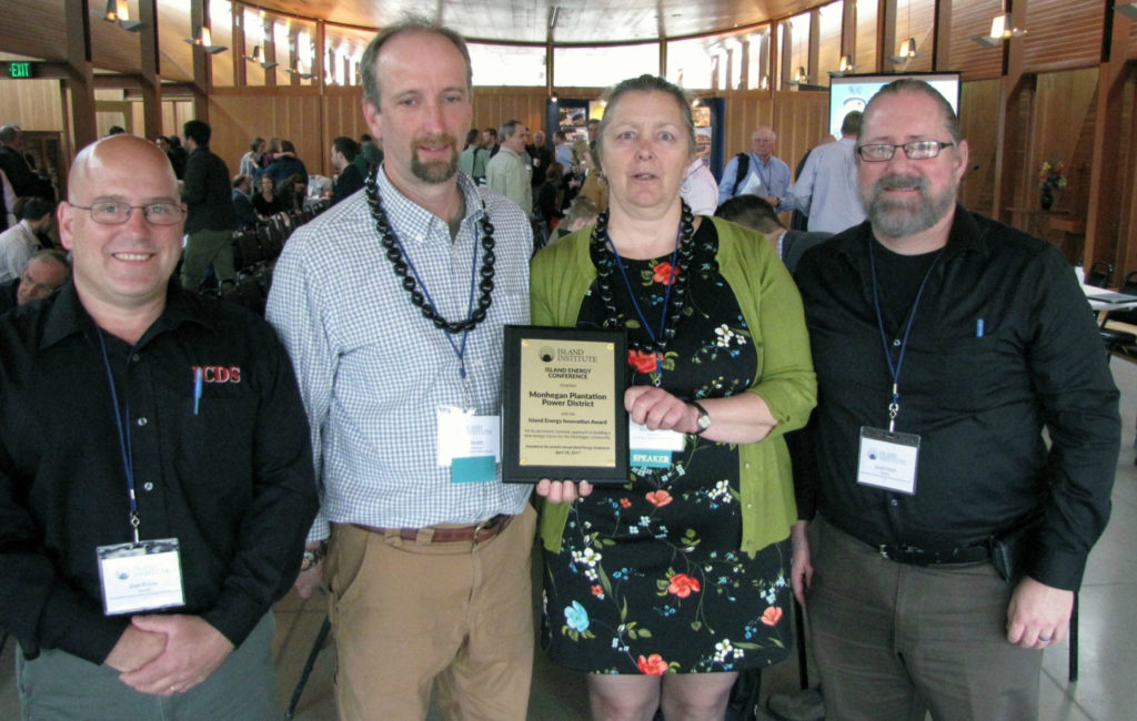 Marian Chioffi and Chris Smith of the Monhegan Plantation Power District (center) were joined by representatives of Innovative Construction & Design Solutions