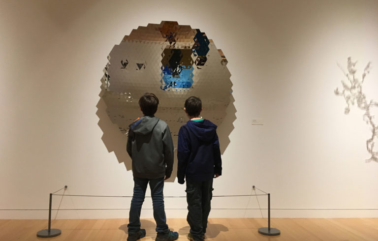 TLC students check out one of the pieces inside the art museum at Colby College during the spring TLC field trip.