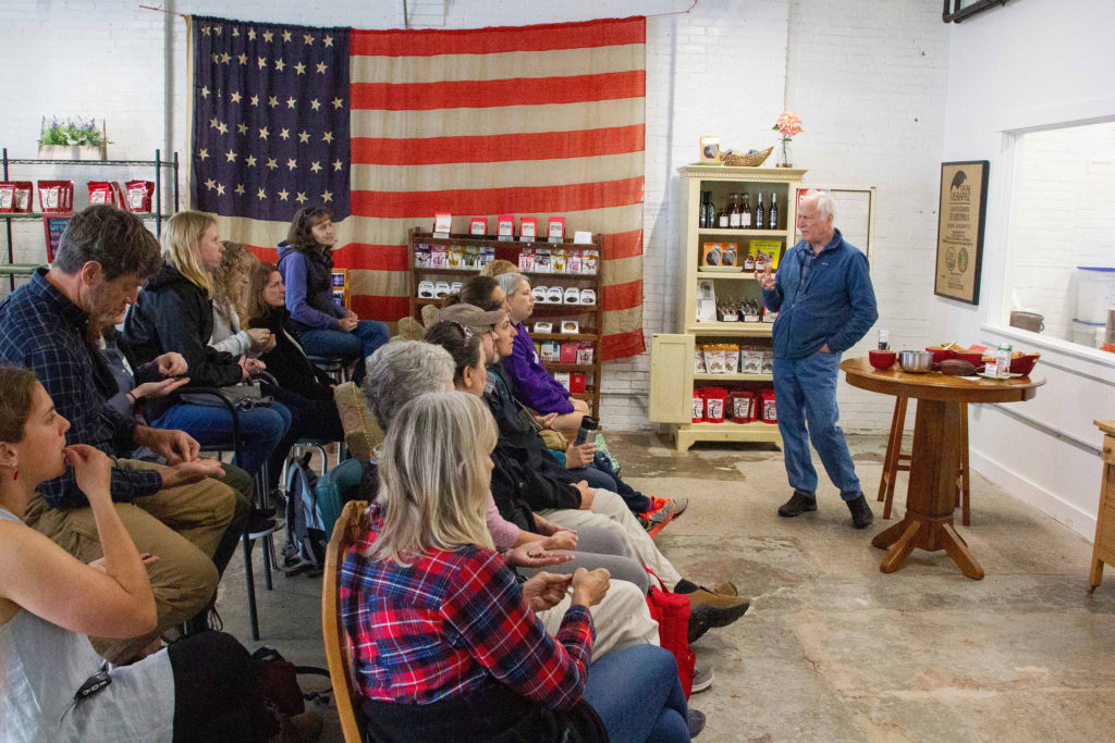 Participants get a tour of the Bixby & Co. chocolate factory during the first day of the 2019 Island Teachers Conference.