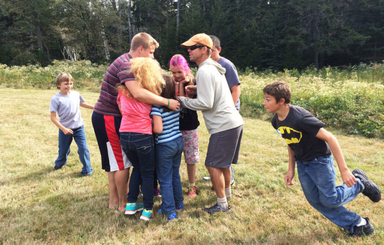 Students who are part of the Outer-Islands Teaching and Learning Collaborative play outside during an inter-island field trip.