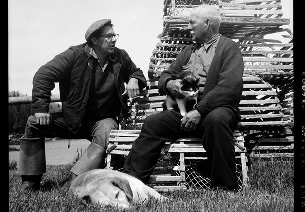 Fisherman George Curtis and retired fisherman William Leaman talk fishing (of course) outside of Leaman’s fish house in Owls Head in 1957.