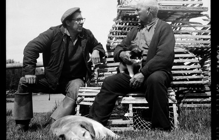 Fisherman George Curtis and retired fisherman William Leaman talk fishing (of course) outside of Leaman’s fish house in Owls Head in 1957.