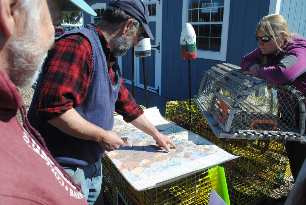 Dave Thomas looks at a map we created with data from the Northeast Ocean Data Portal. He explained that lobster are now found on bottom types that used to be unproductive.