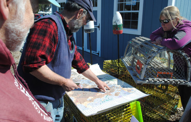 Dave Thomas looks at a map we created with data from the Northeast Ocean Data Portal. He explained that lobster are now found on bottom types that used to be unproductive.