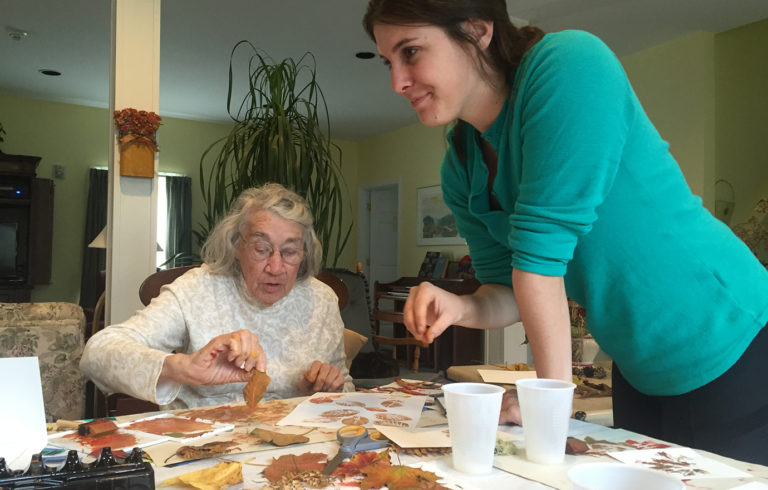 Maddey with a resident at the Ivan Calderwood Homestead