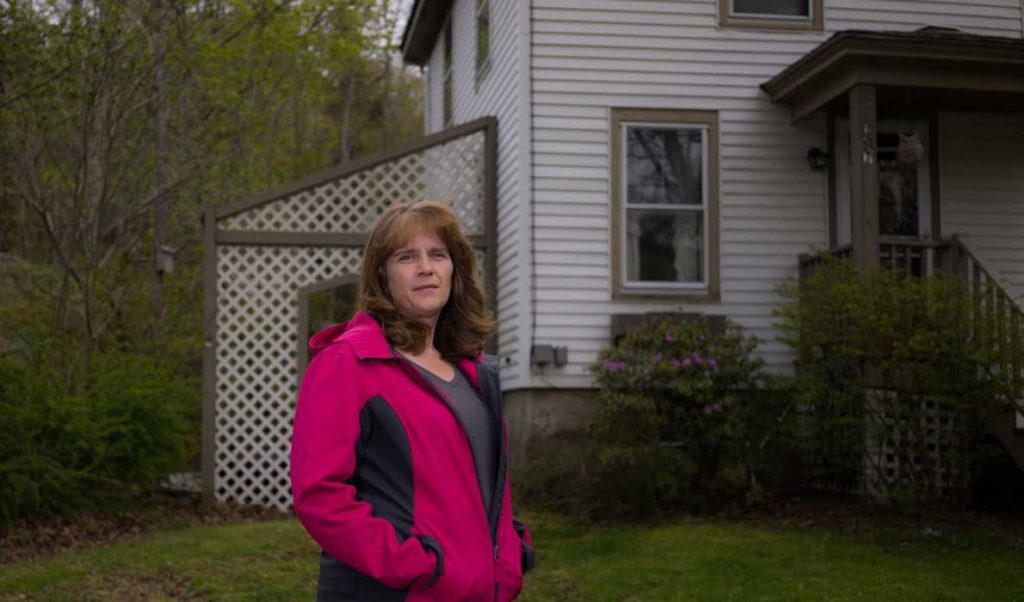Tracy Ames outside the home at 187 Main Street she and her family will now call home