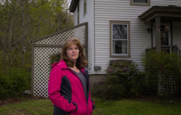 Tracy Ames outside the home at 187 Main Street she and her family will now call home