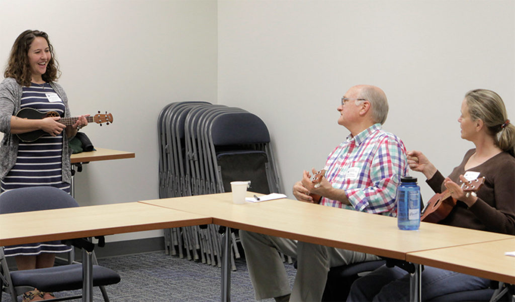 The columnist leads a workshop on ukulele playing at the Island Teachers Conference.