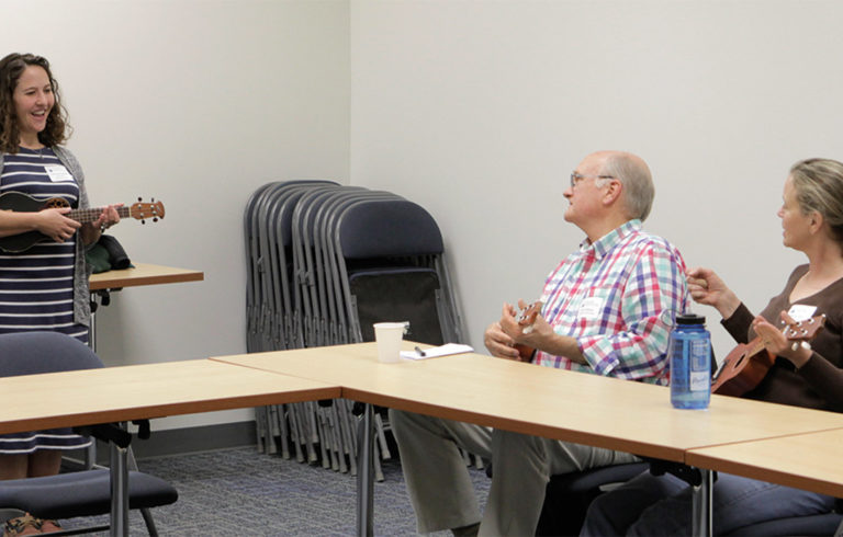 The columnist leads a workshop on ukulele playing at the Island Teachers Conference.