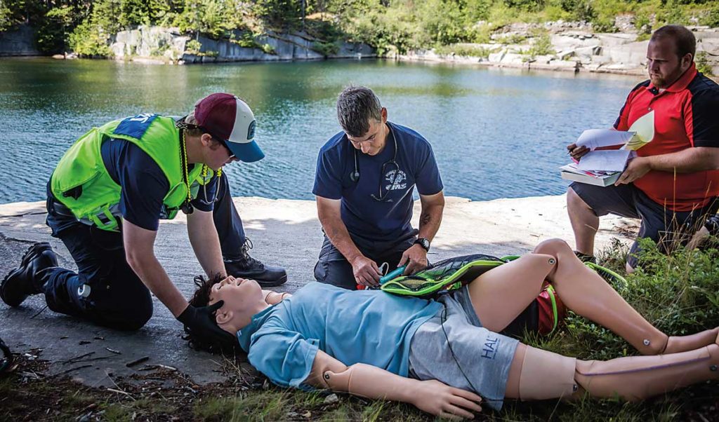 Emergency response volunteers practice with a mannequin on Vinalhaven.