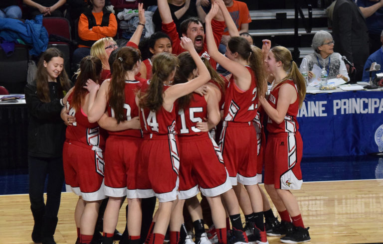 The Vinalhaven Vikings girls basketball team celebrates its Class D state championship in Bangor on Friday