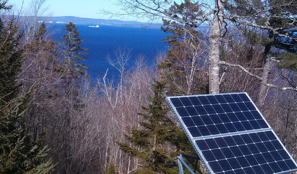 A photovoltaic panel in a yard on Islesboro.