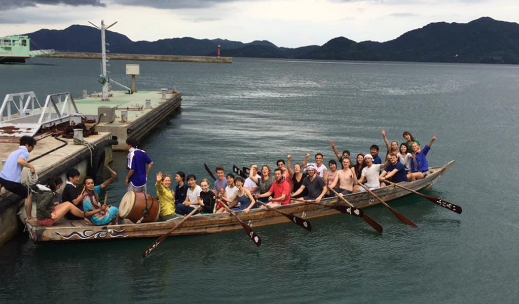 The HELIO group tries rowing a local "dragon" boat.