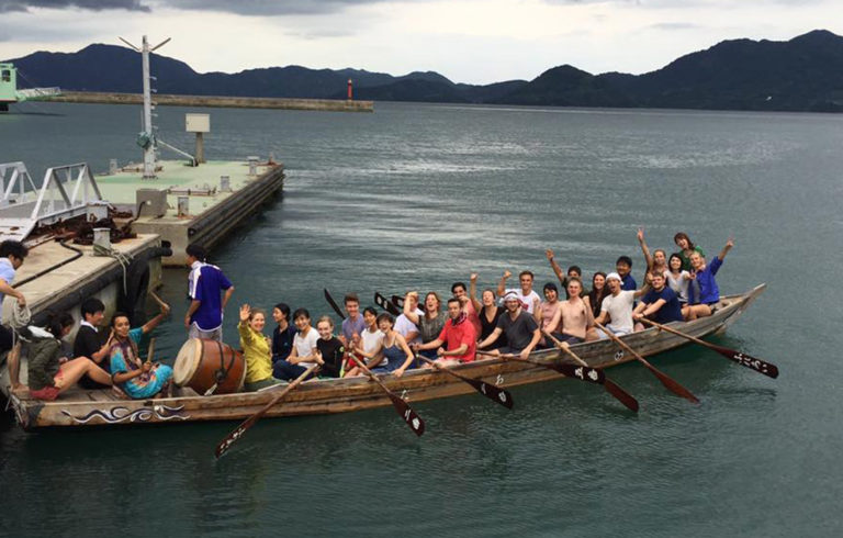 The HELIO group tries rowing a local "dragon" boat.