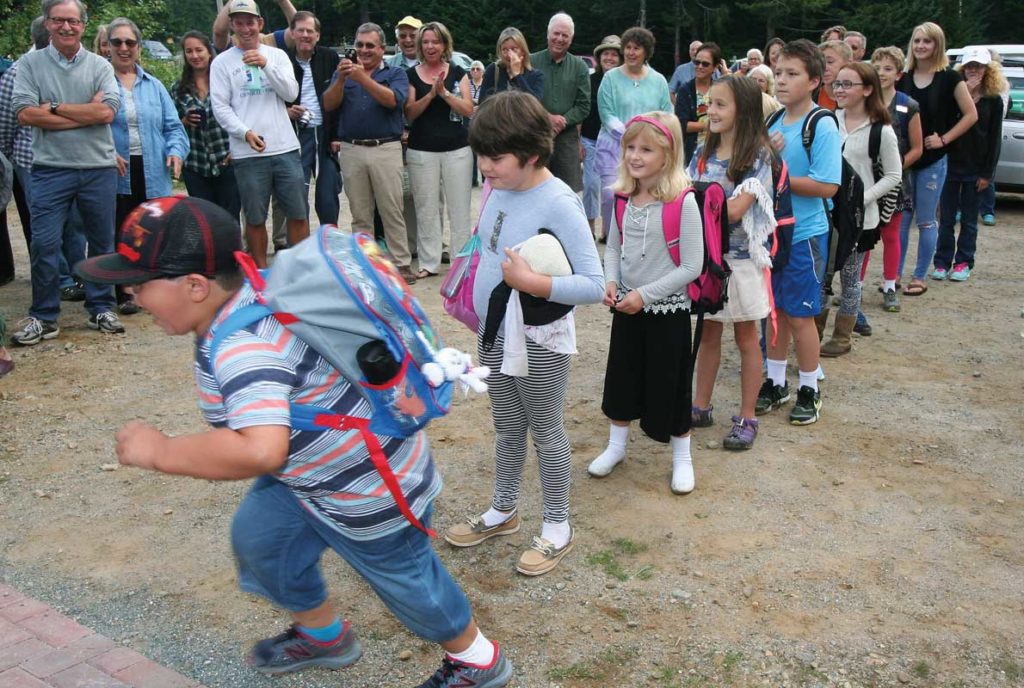 Students line up to enter the Longfellow school on Great Cranberry Island. The school reopened on Sept. 1.