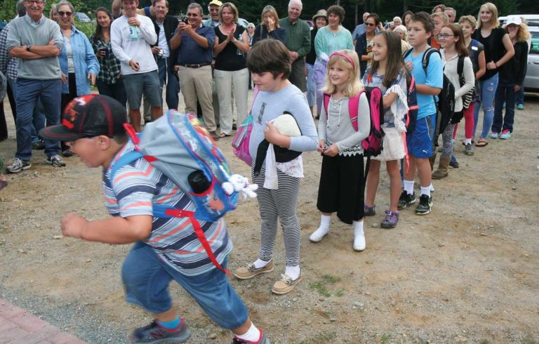 Students line up to enter the Longfellow school on Great Cranberry Island. The school reopened on Sept. 1.