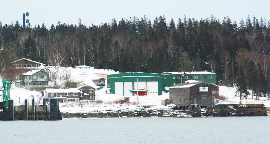 The Morris Yachts yard in Bass Harbor is up for sale. The old Sim Davis building is on the right.