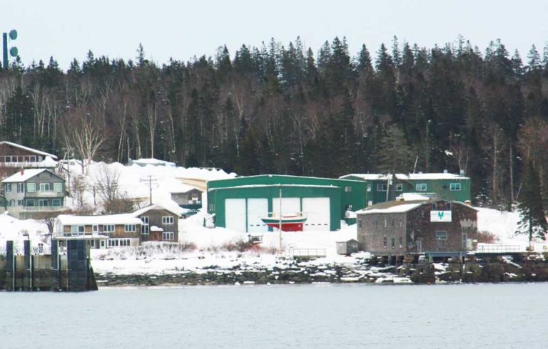 The Morris Yachts yard in Bass Harbor is up for sale. The old Sim Davis building is on the right.