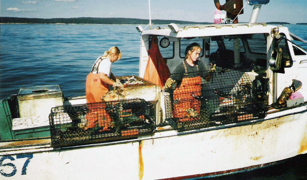 Sisters Betsy and Jill Philbrook fish from their boat off Swan's Island. Betsy first fished with her grandmother