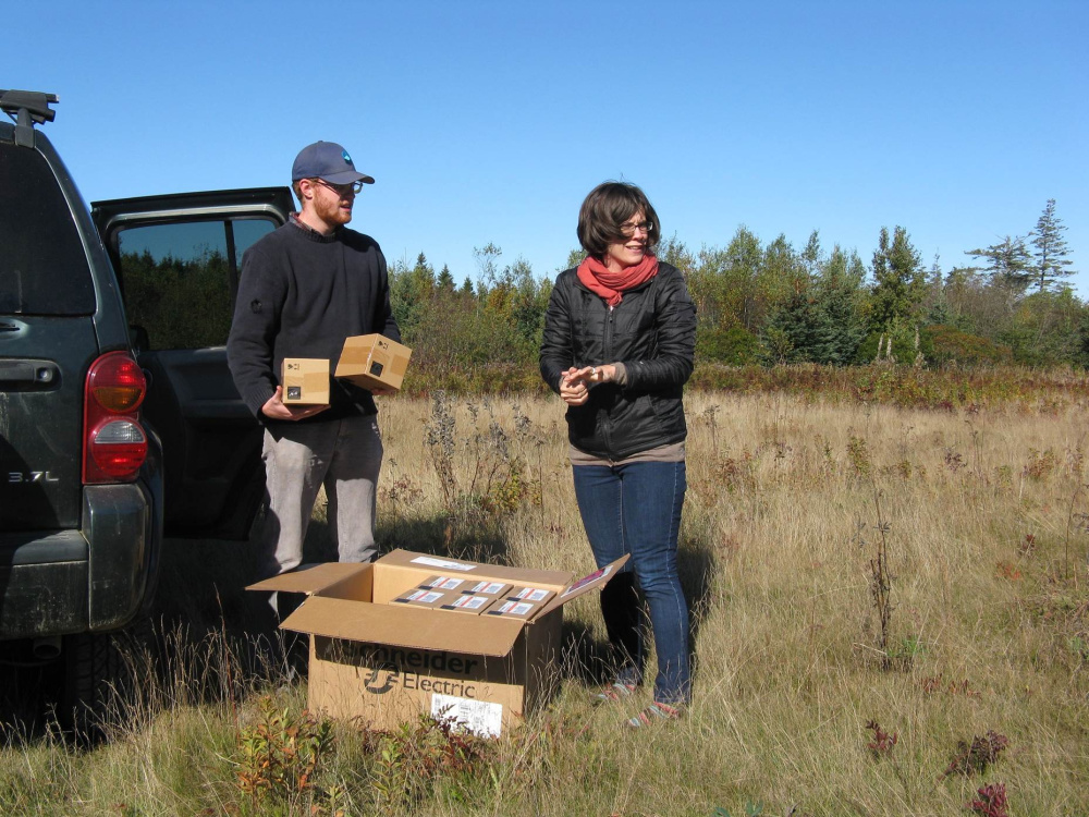 Ben Algeo and Suzanne MacDonald unload boxes of LEDs