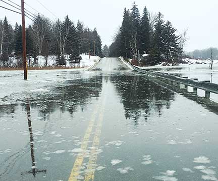 This road on Vinalhaven floods more than a dozen times a year (shown here during a high tide on Feb. 21