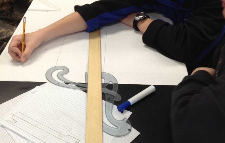 Students at Deer Isle-Stonington High School design lobster boats.