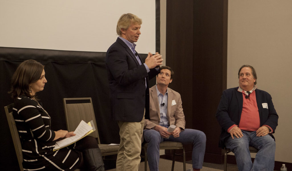 JB Turner of Belfast's Front Street Shipyard speaks at the Island Institute's Waypoints Forum in Portland on Jan. 19. At left is the Island Instiute's Briana Warner. At far right is Mark Ouellette of Axiom Technologies