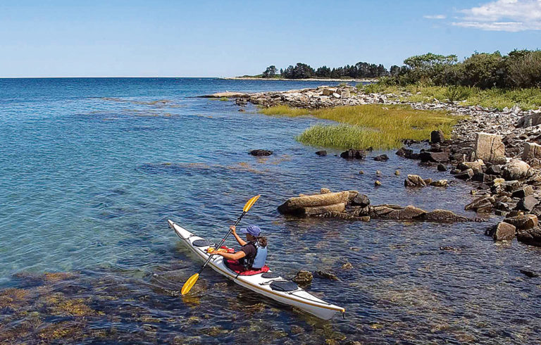 A kayaker explores one of the islands on the trail.