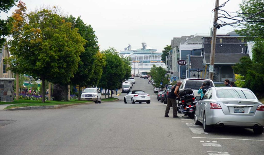 A cruise ship looms over a view of West Street