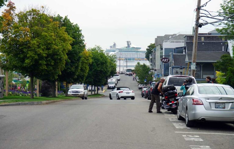 A cruise ship looms over a view of West Street