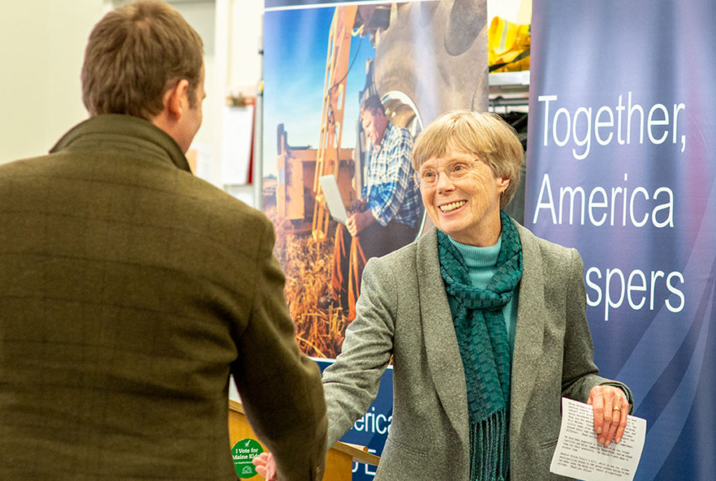 Arrowsic's Sukey Heard greets the Island Institute's Nick Battista at the Jan. 30 event.