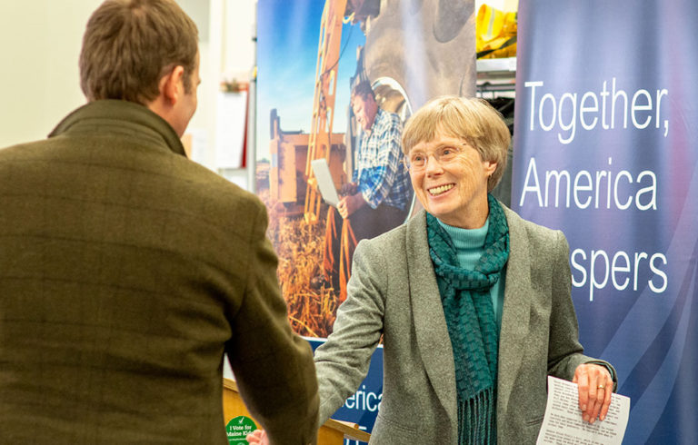 Arrowsic's Sukey Heard greets the Island Institute's Nick Battista at the Jan. 30 event.