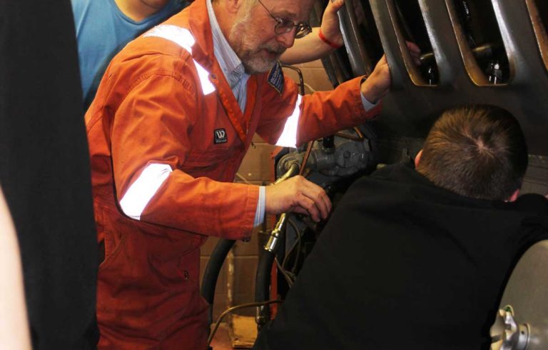 Michael Young at work with students.