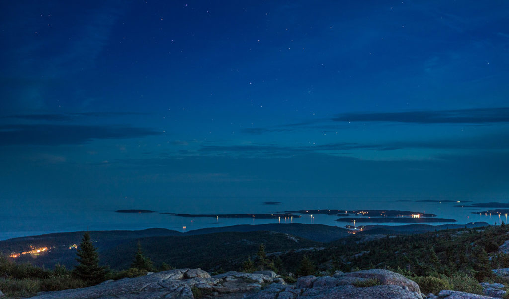 Night sky from Cadillac Mountain with the Cranberry Isles in view.