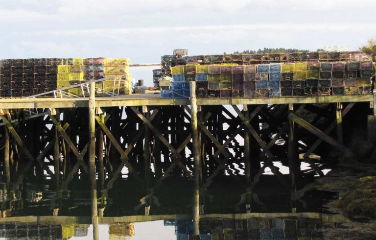 Lobster traps piled on a dock in Corea.