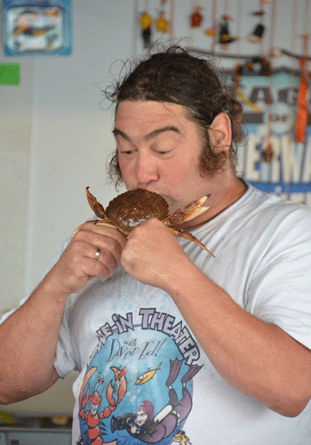 Diver Ed kisses a crab.