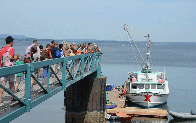 Visitors line up to board Diver Ed's boat in Bar Harbor.