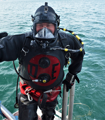 Diver Ed emerges from the water.