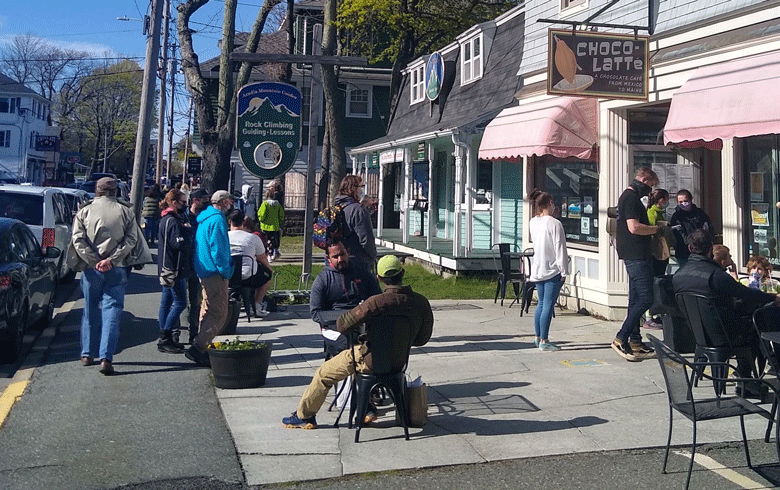 Folks enjoy tasty treats at Choco-Latte in downtown Bar Harbor on the first weekend in May, as tourism traffic gradually picks up. PHOTO: EZRA SCHREIBER-MACQUAID