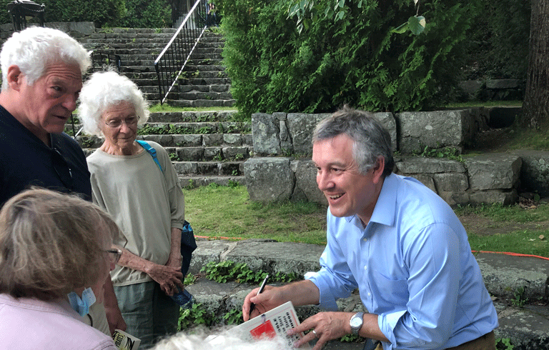 Colin Woodard signs books in Camden.