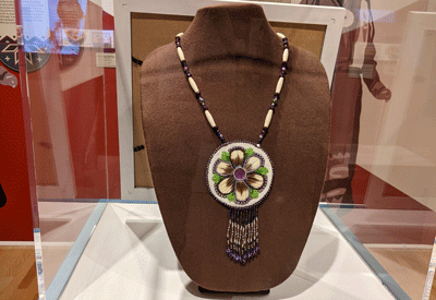 Floral medallion by Norma Jean Saulis. PHOTO: COURTESY ABBE MUSEUM