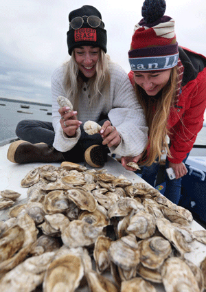 Examining the shells. PHOTO: COURTESY MAINE AQUACULTURE ASSOCIATION