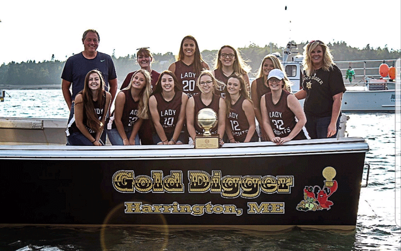 he Gold Ball-winning basketball team from Narraguagus High School, 2016, with their coach, the lobster fisherman "Olivia Marshall" in the book, whose real name is Heather Thompson (back row, far right). The team is aboard the fishing boat Thompson named in honor of the championship team. “Audrey Barton”—whose real name is Kelli Kennedy—is in the back row, third from left. “Mckenna Holt”—whose real name is Laniew Perry—is in the back row, next to Olivia Marshall.