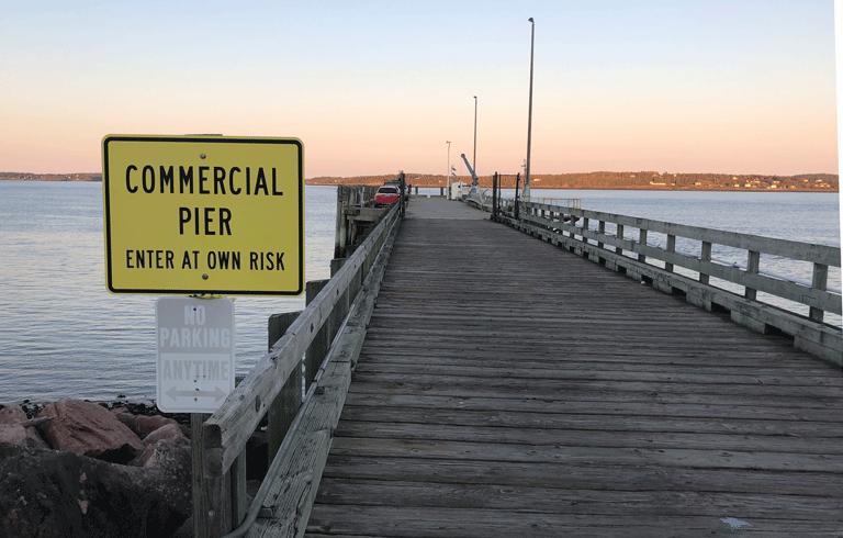 A working waterfront with a warning. PHOTO: TOM GROENING
