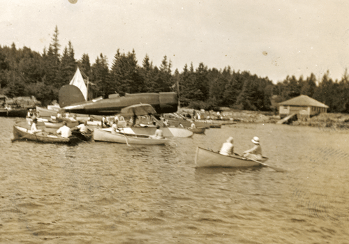 North Haven residents in their boats surround the Lindbergh plane. PHOTO: COURTESY NORTH HAVEN HISTORICAL SOCIETY