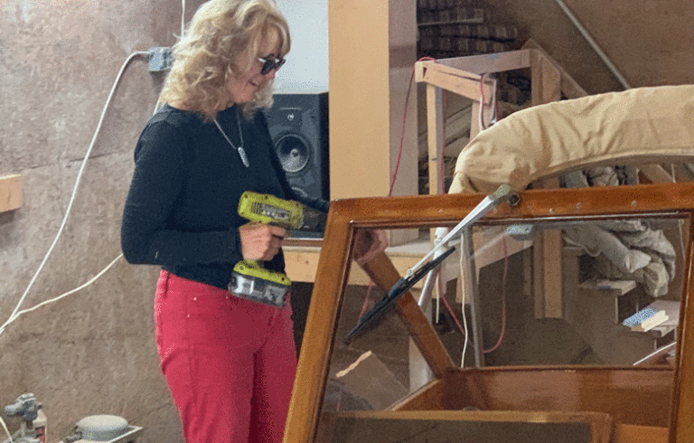 Kathy Walsh at work on her boat. PHOTO: COURTESY KATHY WALSH